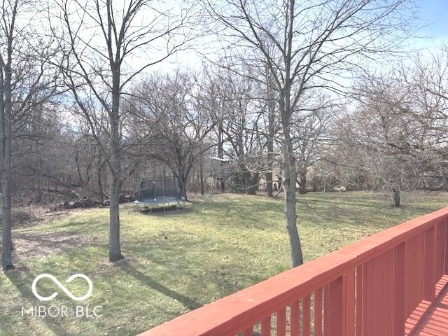 view of yard with a trampoline