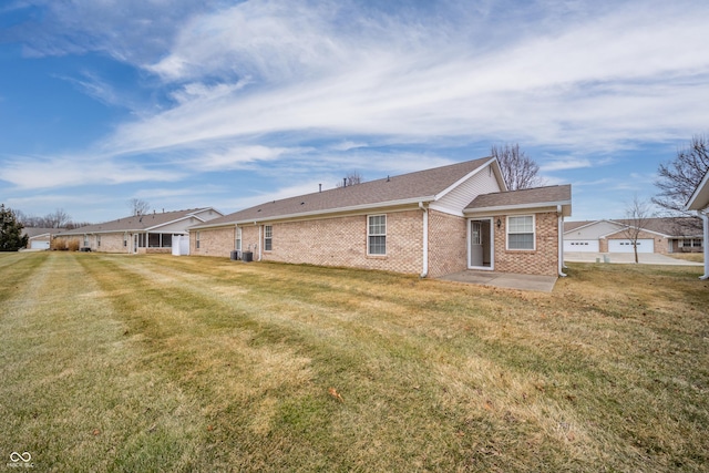 rear view of house with a yard