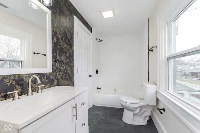 full bathroom featuring shower / bathing tub combination, vanity, and toilet