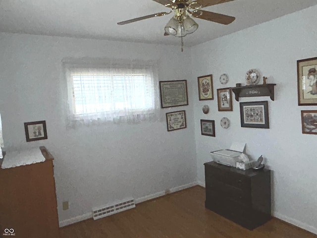 interior space featuring dark hardwood / wood-style flooring and ceiling fan