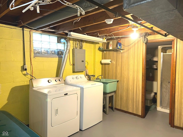 laundry room with separate washer and dryer, sink, and electric panel