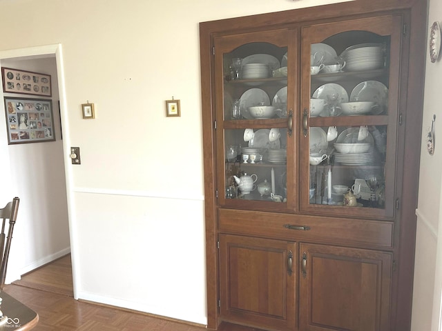 interior details featuring parquet flooring