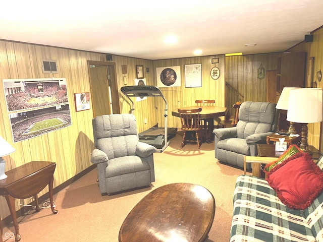 carpeted living room with wooden walls