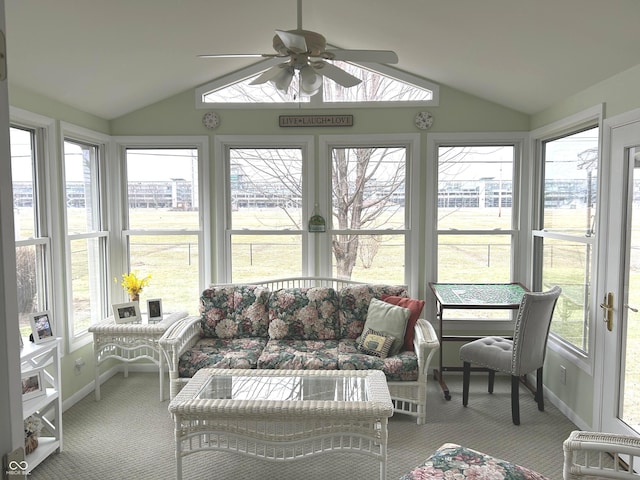 sunroom / solarium featuring ceiling fan and vaulted ceiling