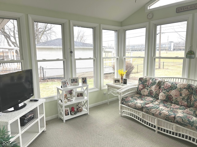 sunroom / solarium featuring vaulted ceiling