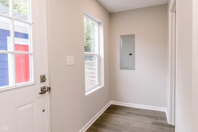 1305 W 23rd St, Indianapolis, IN 46208 - doorway to outside with electric panel, wood finished floors, and baseboards