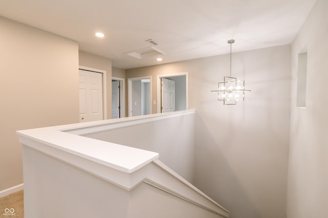 1305 W 23rd St, Indianapolis, IN 46208 - hallway featuring an upstairs landing, recessed lighting, baseboards, and a chandelier