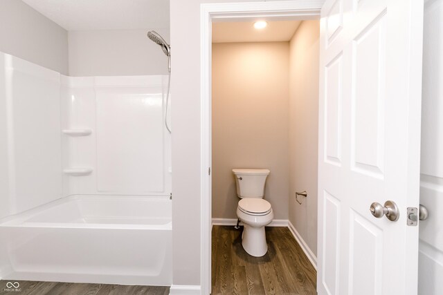 1305 W 23rd St, Indianapolis, IN 46208 - bathroom featuring wood finished floors, toilet, shower / tub combination, and baseboards