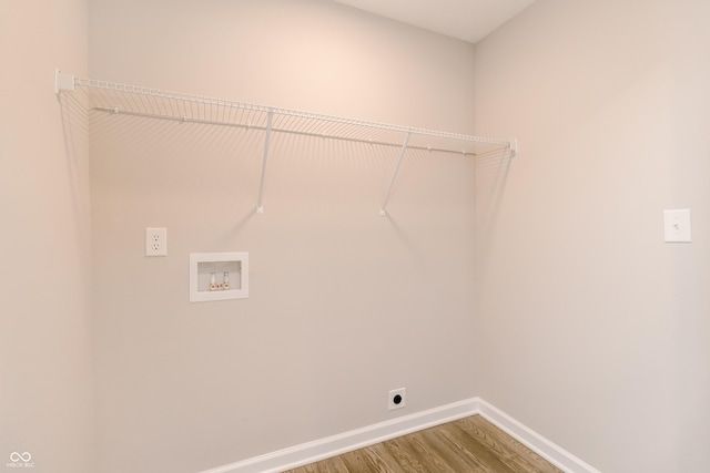 1305 W 23rd St, Indianapolis, IN 46208 - washroom featuring electric dryer hookup, hookup for a washing machine, wood finished floors, and baseboards