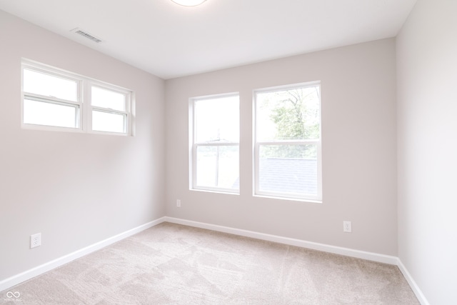 1305 W 23rd St, Indianapolis, IN 46208 - empty room featuring light carpet and baseboards