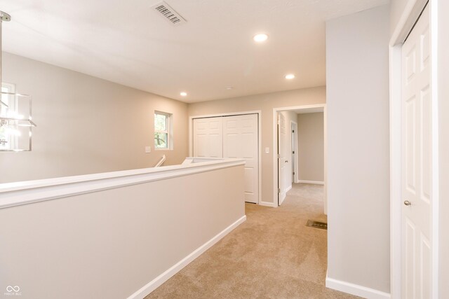 1305 W 23rd St, Indianapolis, IN 46208 - hallway featuring light colored carpet, recessed lighting, and baseboards