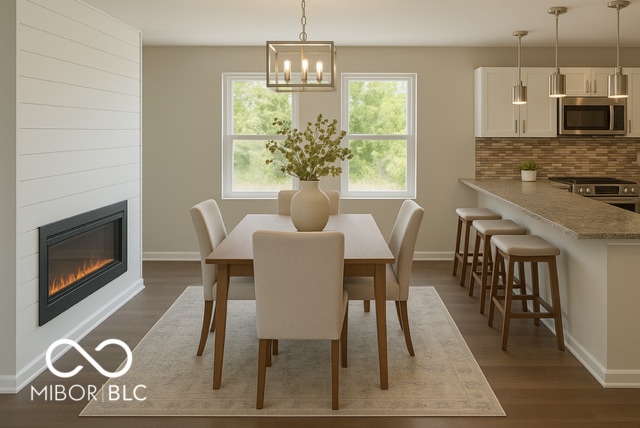 1305 W 23rd St, Indianapolis, IN 46208 - dining space with baseboards and dark wood-type flooring