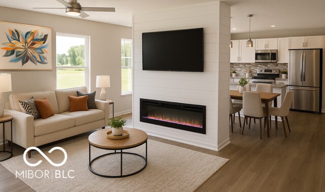 1305 W 23rd St, Indianapolis, IN 46208 - living room featuring ceiling fan, dark wood-type flooring, recessed lighting, a large fireplace, and baseboards