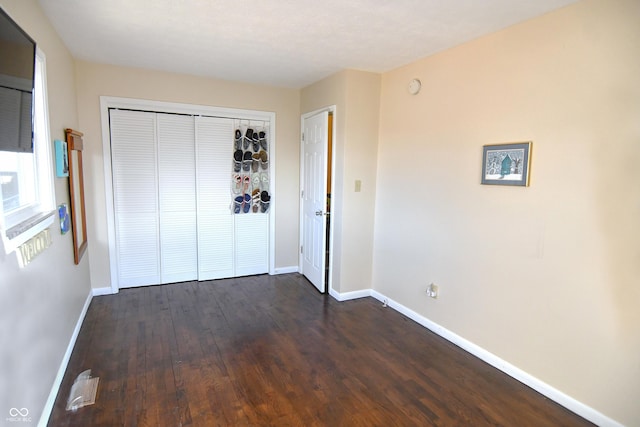 2847 Merts Dr, Indianapolis, IN 46237 - unfurnished bedroom featuring dark hardwood / wood-style floors and a closet