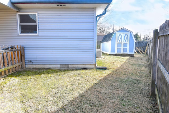 2847 Merts Dr, Indianapolis, IN 46237 - view of property exterior featuring a lawn, central air condition unit, and a storage shed
