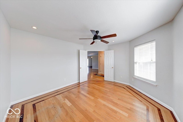 unfurnished bedroom with recessed lighting, light wood-style flooring, a ceiling fan, and baseboards