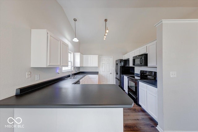 kitchen with white cabinetry, black appliances, dark countertops, and a sink