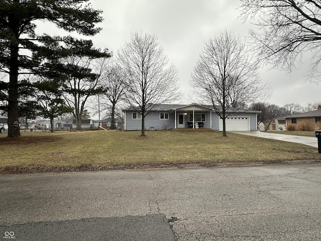 view of front facade with a garage and a front lawn