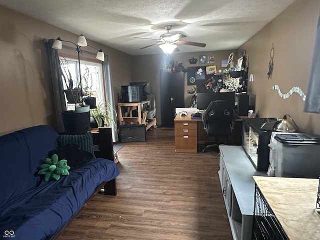 office area with ceiling fan, a textured ceiling, and wood finished floors