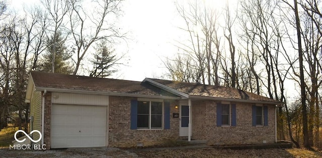 ranch-style house featuring a garage