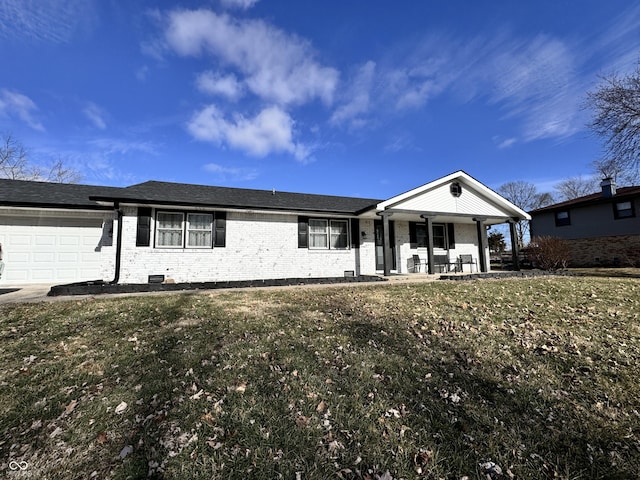 ranch-style home with a garage, covered porch, and a front lawn