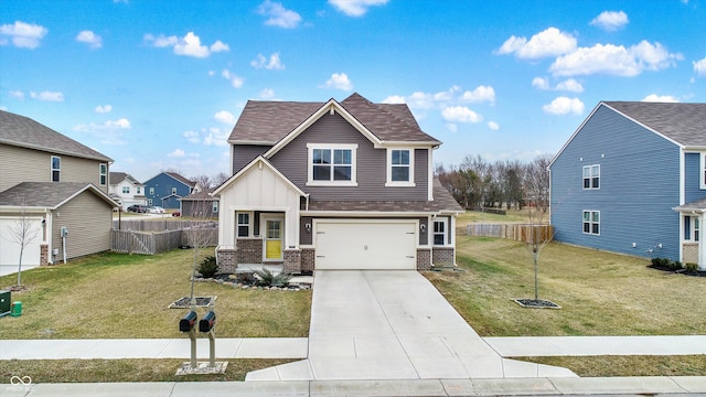 view of front of house with a garage and a front lawn