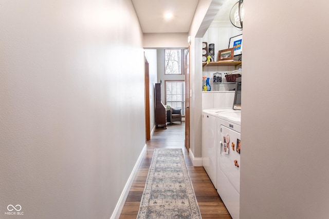 washroom with separate washer and dryer and dark hardwood / wood-style flooring