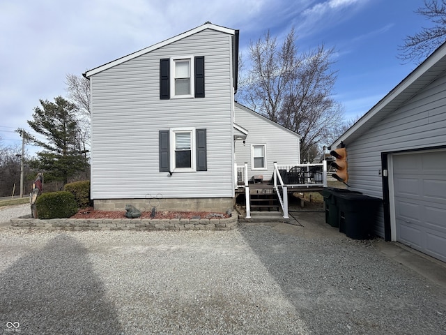 view of front of home featuring a garage and a deck