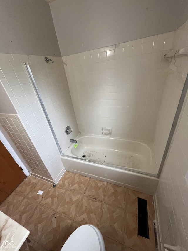 bathroom with toilet and shower / bath combination