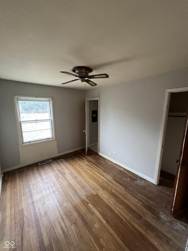 unfurnished bedroom with wood-type flooring and ceiling fan