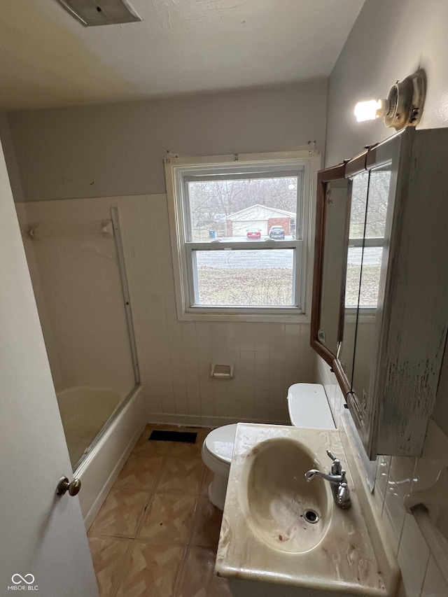 full bathroom featuring shower / tub combination, sink, and toilet