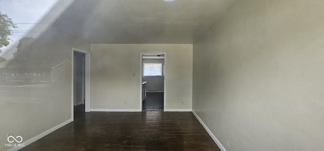 bonus room featuring dark wood-type flooring