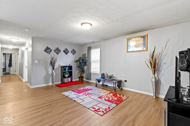 interior space with hardwood / wood-style floors and a textured ceiling