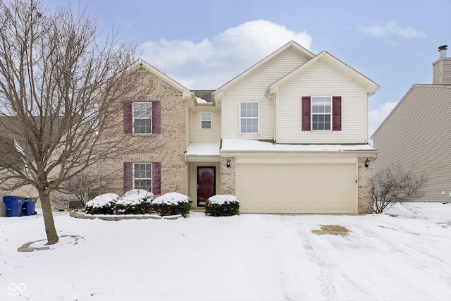 traditional-style home with brick siding and an attached garage