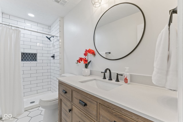 bathroom with tile patterned floors, visible vents, toilet, a shower stall, and vanity