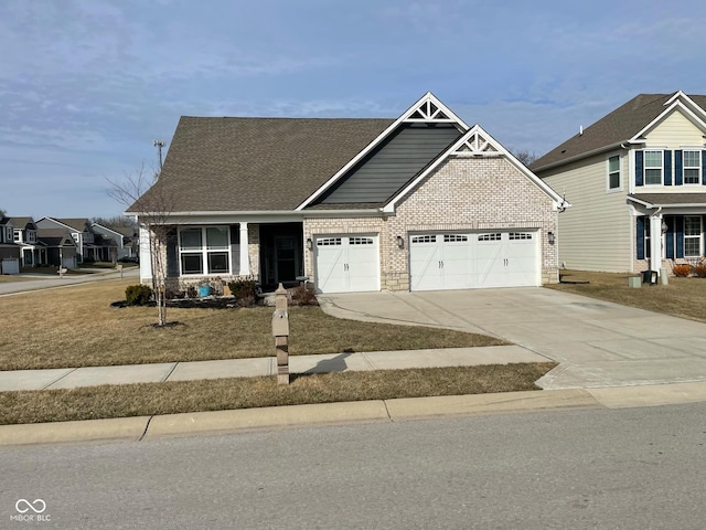 craftsman house with brick siding, a shingled roof, driveway, and a garage