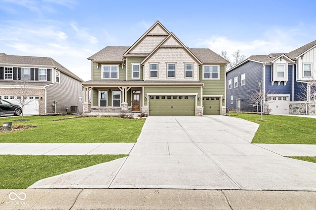 craftsman-style house featuring cooling unit, a garage, a front yard, and covered porch