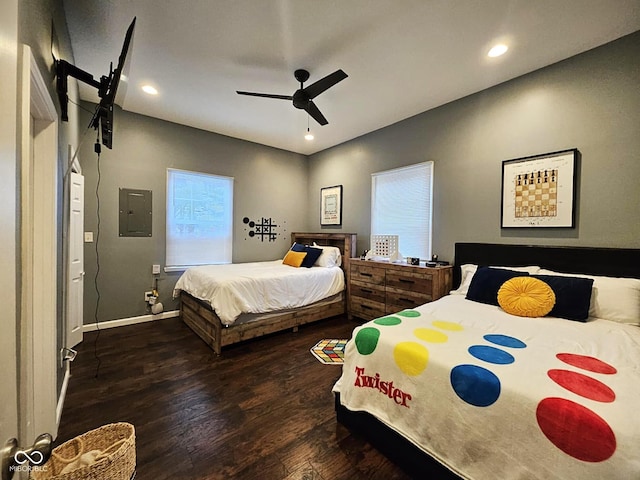 bedroom with dark wood-type flooring, electric panel, and ceiling fan