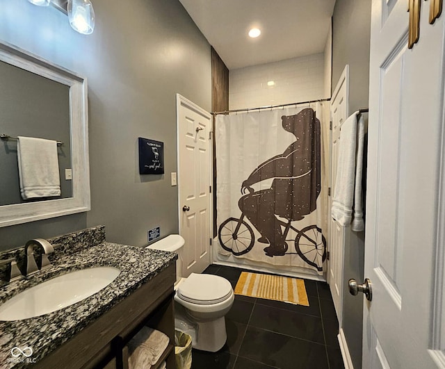 bathroom with walk in shower, tile patterned floors, toilet, and vanity