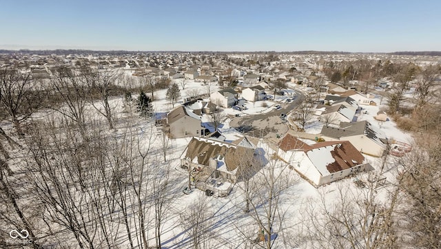 snowy aerial view with a residential view