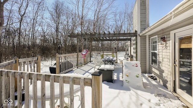 view of snow covered deck