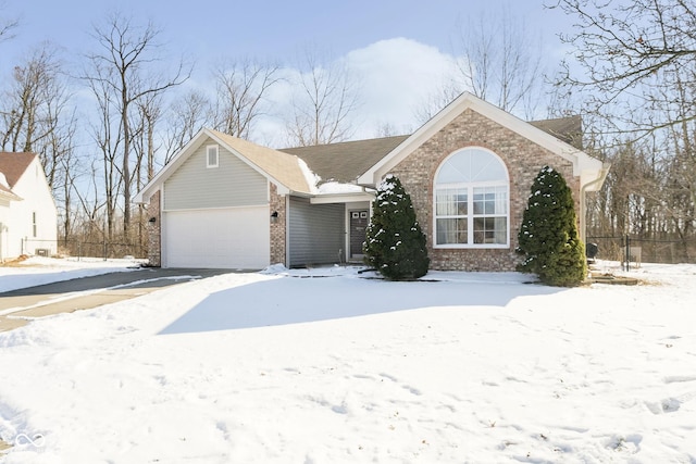 single story home with a garage and brick siding