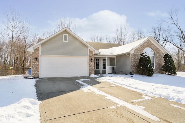 ranch-style home with a garage, driveway, and brick siding