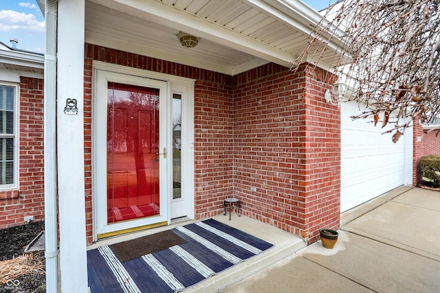 view of exterior entry featuring a garage