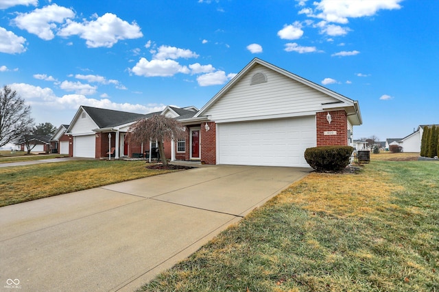 single story home featuring a garage and a front yard