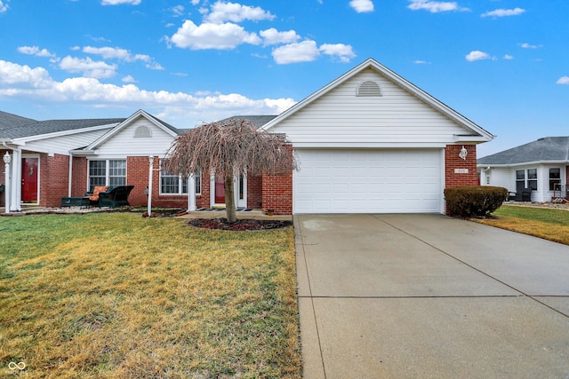 ranch-style house featuring a garage and a front yard