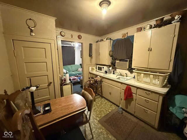 kitchen featuring cooling unit and sink