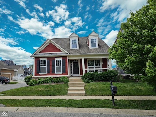 12964 Walbeck Dr, Fishers, IN 46037 - view of front of house with a porch, a front yard, and roof with shingles