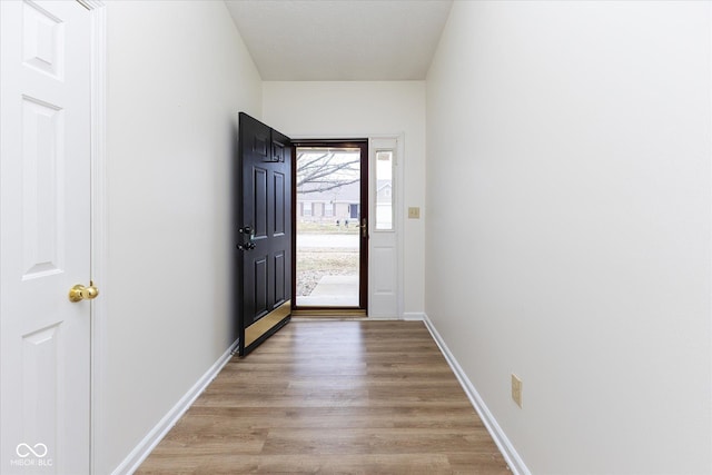 doorway to outside featuring light wood-type flooring