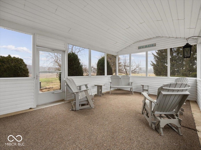 sunroom with vaulted ceiling and wooden ceiling